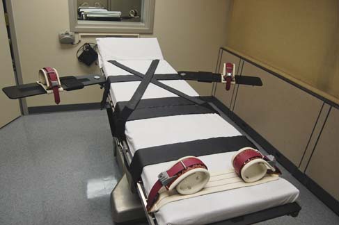 A gurney like the ones used during lethal injection executions. Those executed in the state of Oklahoma spend their last minutes tied to these.